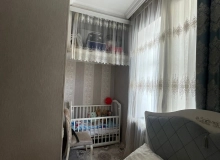 Nərimanov rayonu, Saatlı binanın düz yanında.